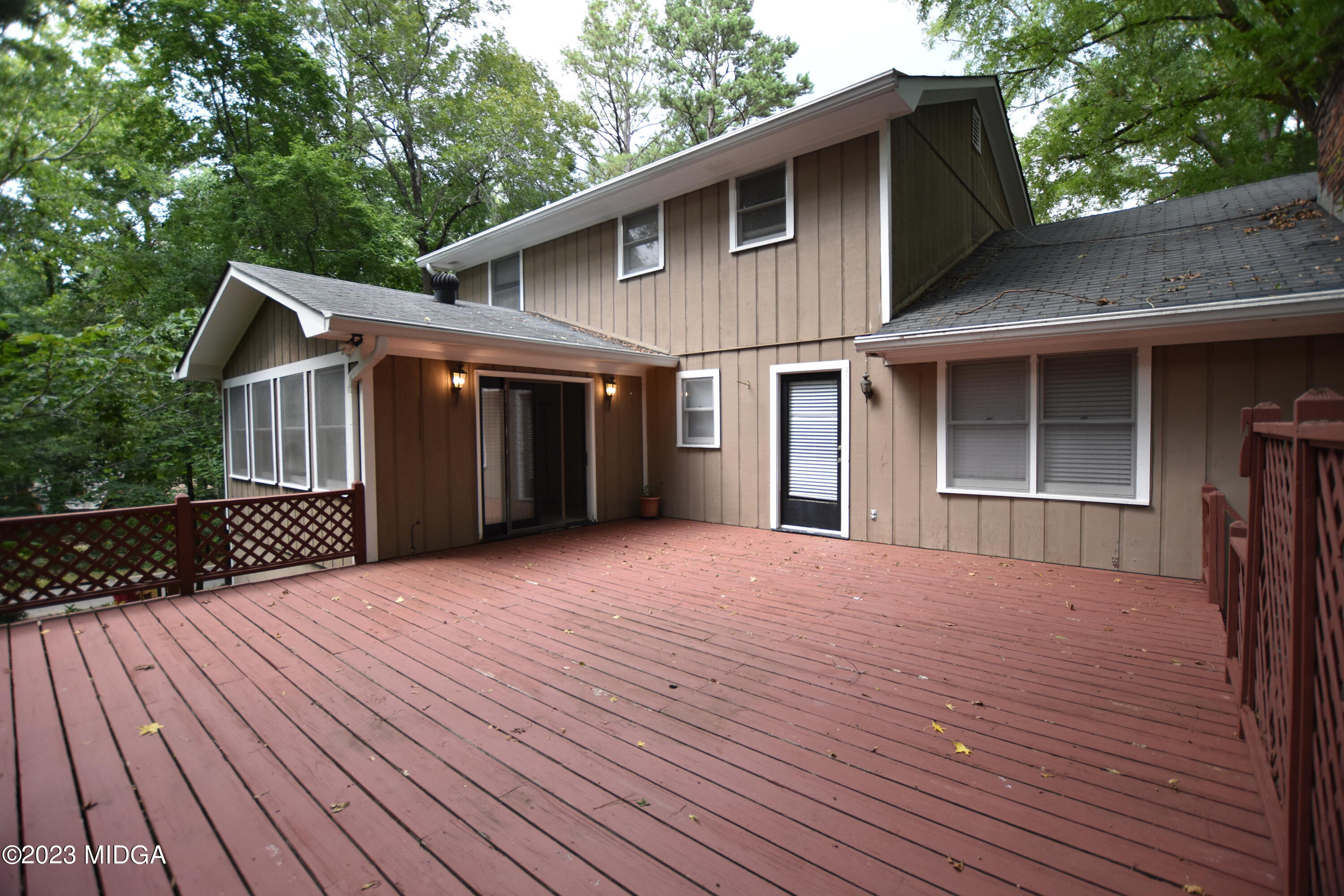 2994 Rolling Road Macon, GA 31204 - Photo 25 of 27 a front view of a house with a yard and garage