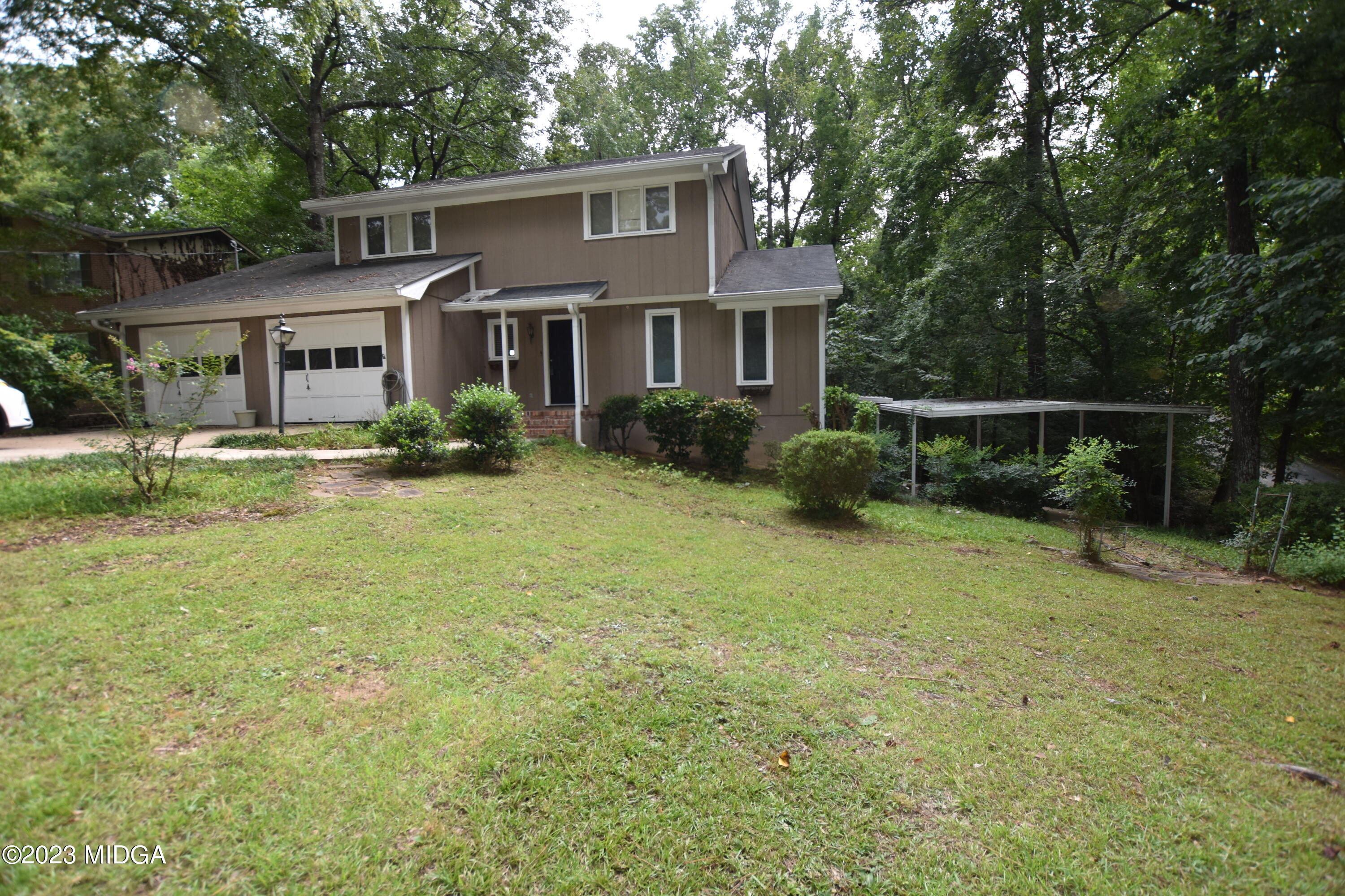 2994 Rolling Road Macon, GA 31204 - Photo 3 of 27 a front view of a house with garden