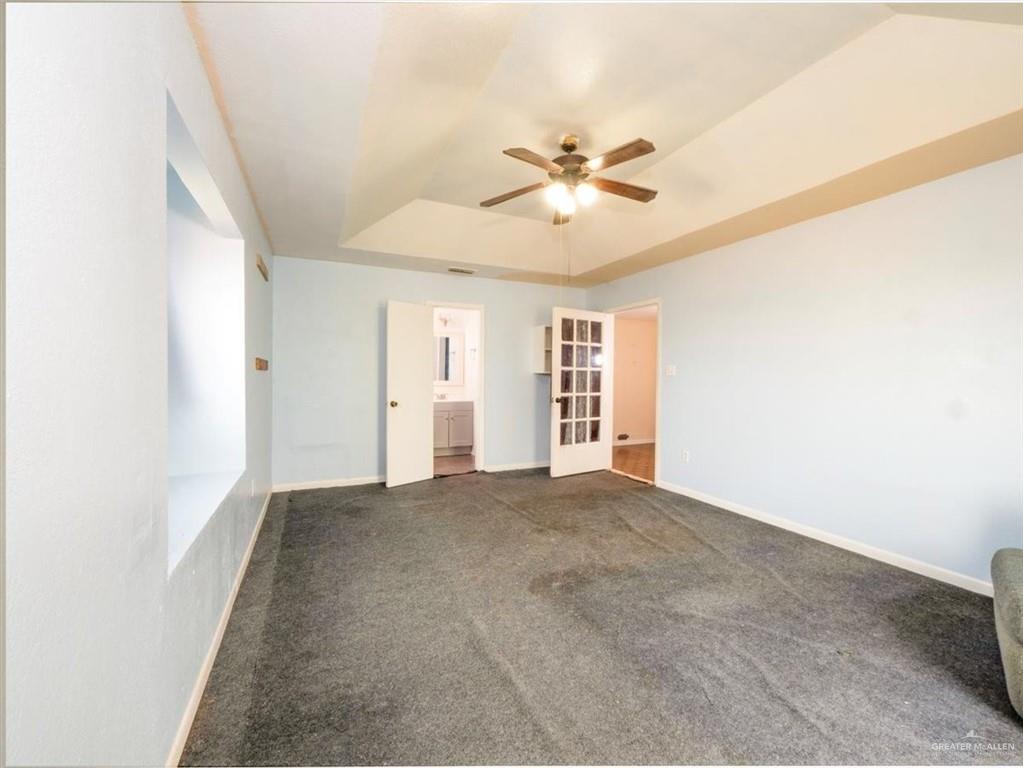 23067 Cragon Road Harlingen, TX 78552 - Photo 18 of 28 a view of an empty room with a window