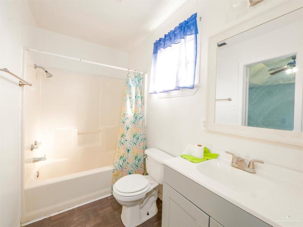 23067 Cragon Road Harlingen, TX 78552 - Photo 19 of 28 a bathroom with a sink toilet and shower