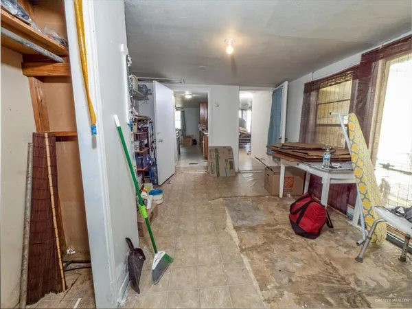 a kitchen with wooden cabinets and a sink