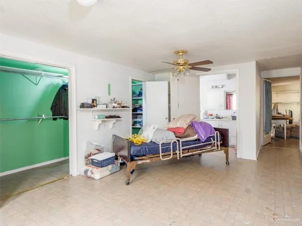 a bathroom with a sink mirror vanity and toilet