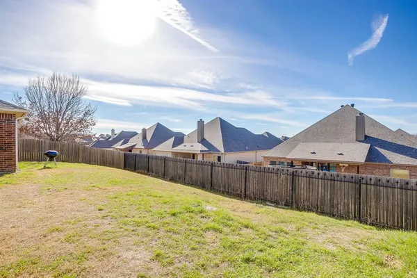 a swimming pool with wooden fence