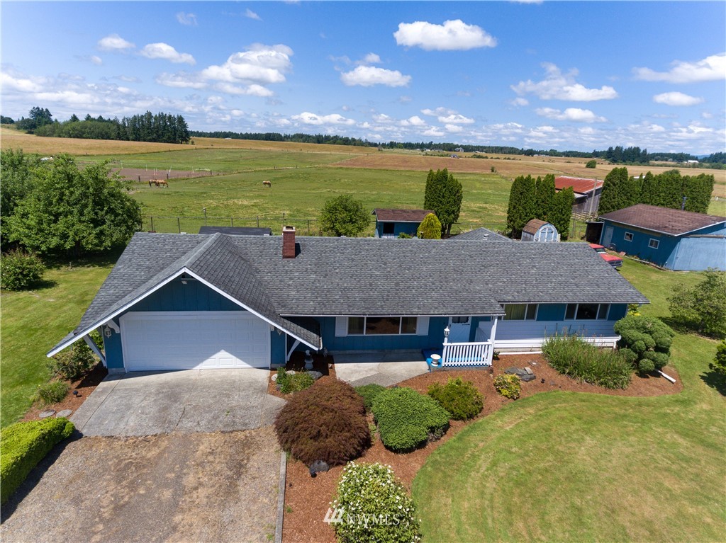 659 Spencer Road Toledo, WA 98591 - Photo 1 of 25 a aerial view of a house with swimming pool and a yard