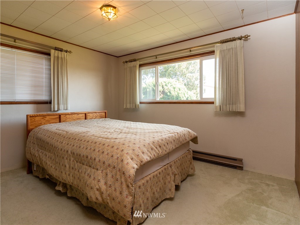 659 Spencer Road Toledo, WA 98591 - Photo 12 of 25 a bed sitting in a bedroom next to a window