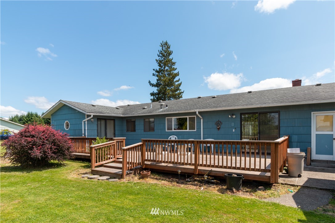659 Spencer Road Toledo, WA 98591 - Photo 17 of 25 a view of a deck with a table and chairs