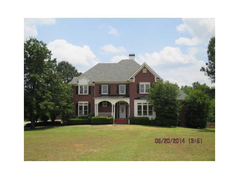 4931 Bill Cheek Road Auburn, GA 30011 - Photo 1 of 1 Exterior Front. Beautiful home on 5.71 acres in desirable Mill Creek Schools!