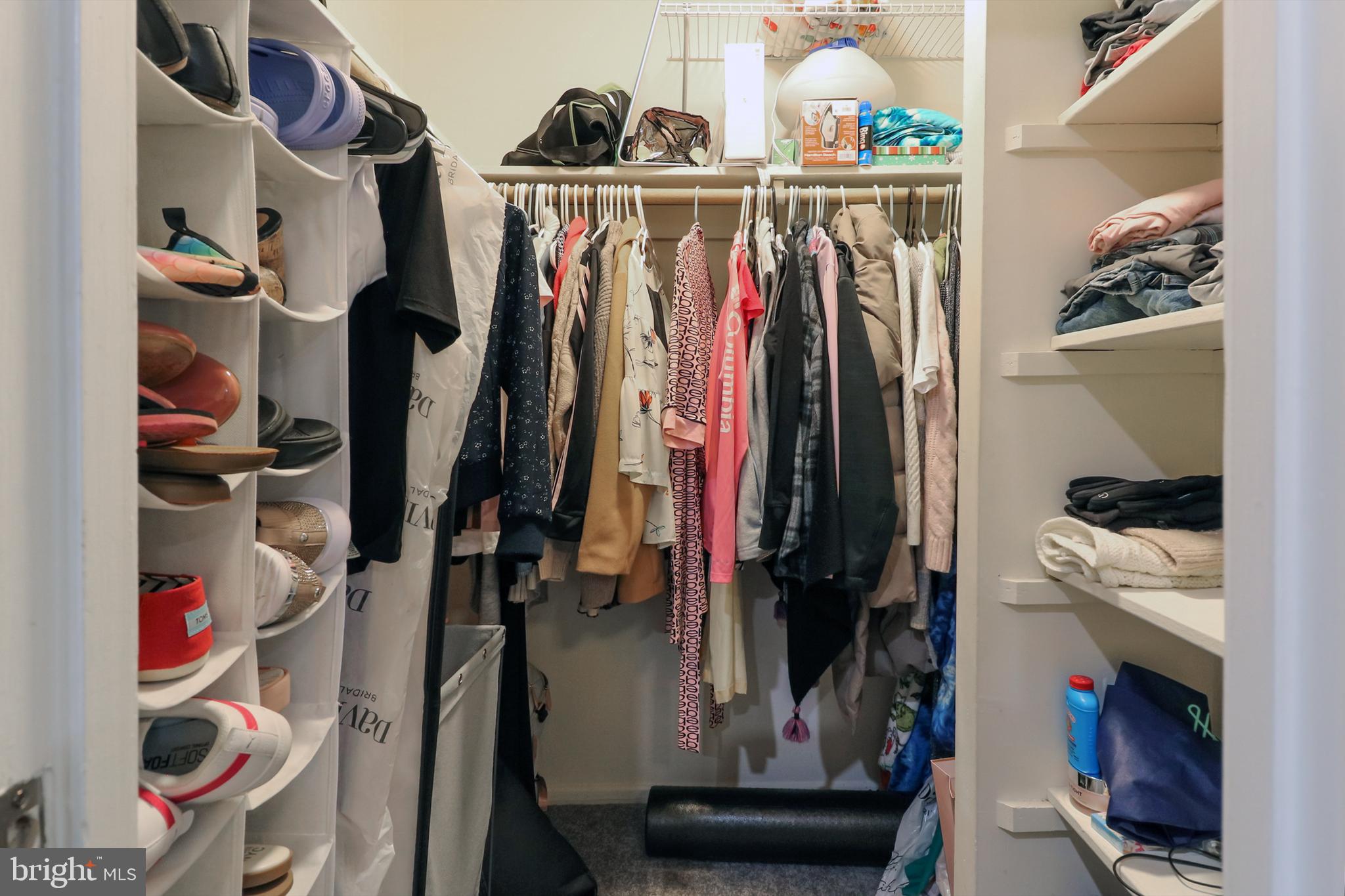3210 South 28th Street, Unit 404 Alexandria, VA 22302 - Photo 17 of 25 a view of walk in closet with clothes and shoes