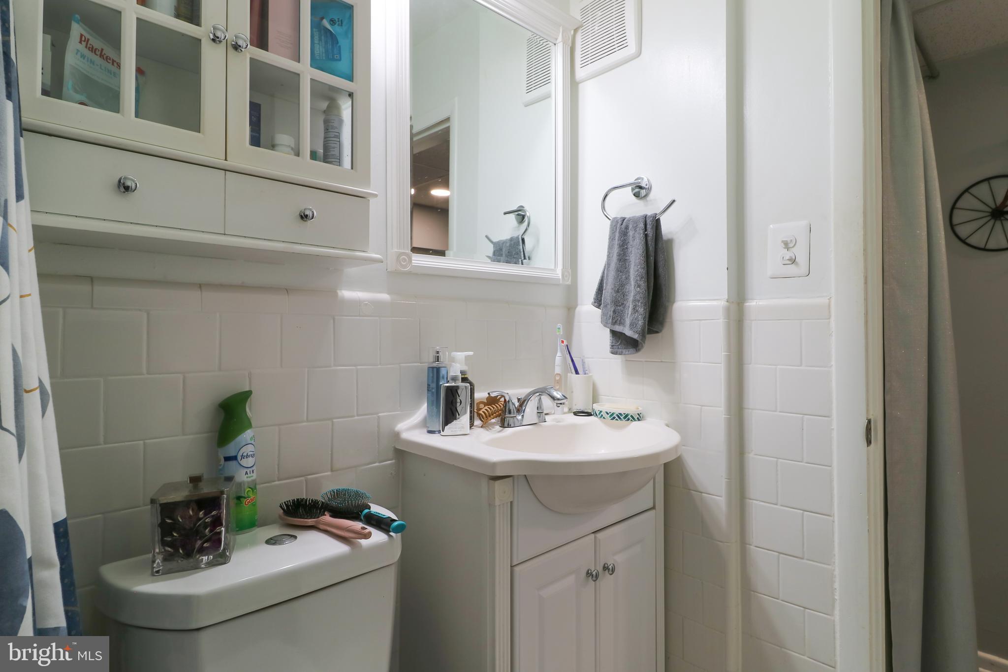 3210 South 28th Street, Unit 404 Alexandria, VA 22302 - Photo 19 of 25 a bathroom with a sink and a toilet