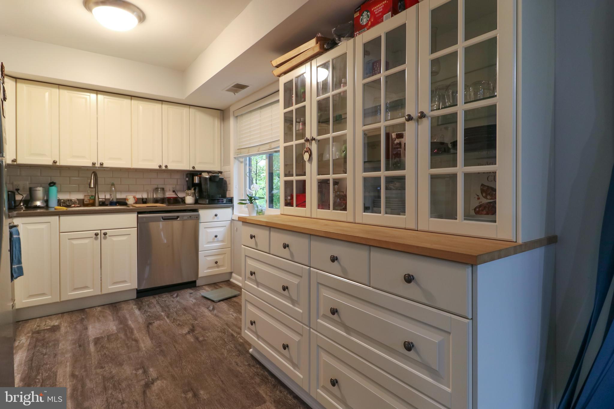 3210 South 28th Street, Unit 404 Alexandria, VA 22302 - Photo 2 of 25 a kitchen with granite countertop white cabinets and white appliances