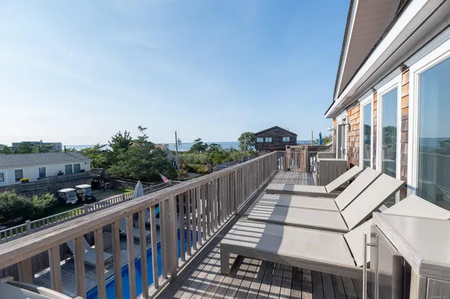 a view of balcony with furniture