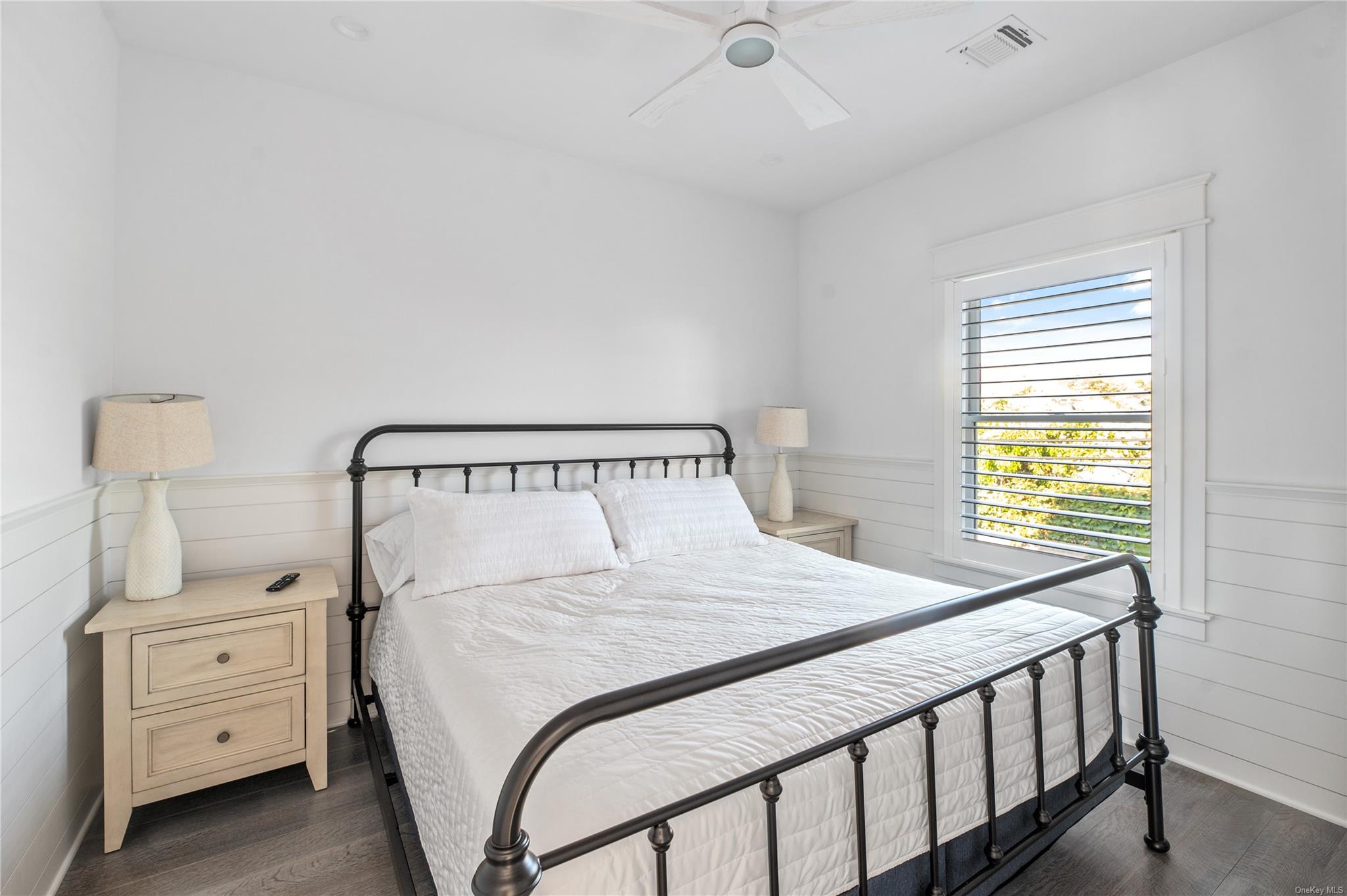 335 Surf Road Ocean Beach, NY 11770 - Photo 5 of 12 a bedroom with a bed and window