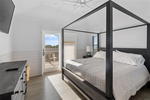 a bedroom with a large bed and a window