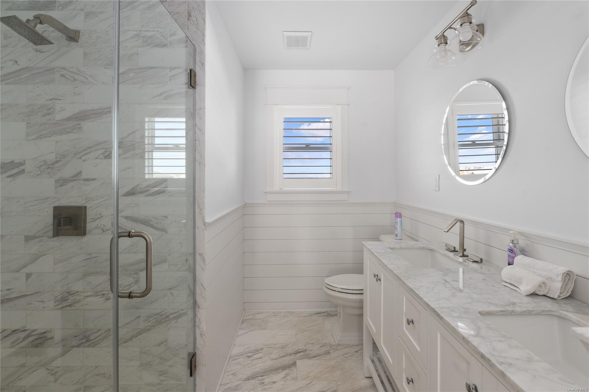 335 Surf Road Ocean Beach, NY 11770 - Photo 10 of 12 a bathroom with a granite countertop sink a toilet and a shower