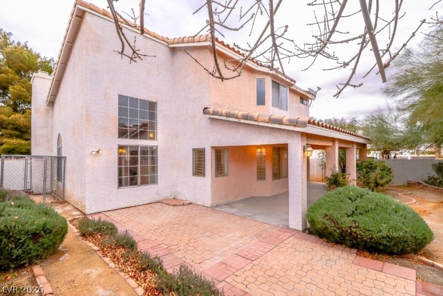 1429 Hawkwood Road Henderson, NV 89014 - Photo 37 of 53 A spacious covered patio and brick paver terrace extend the living space outdoors.