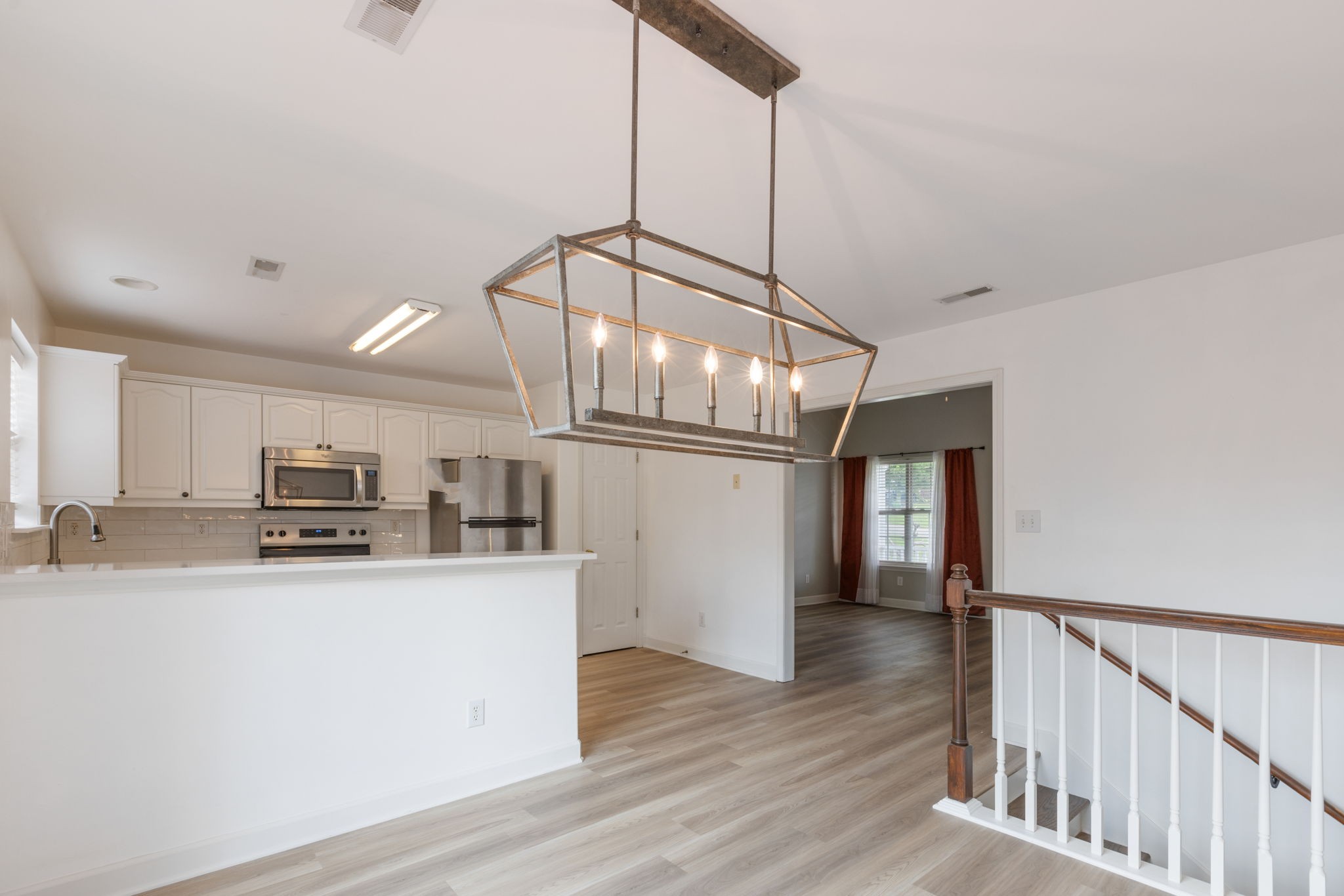 2505 Preston Way Spring Hill, TN 37174 - Photo 11 of 37 a kitchen with stainless steel appliances a sink a stove a refrigerator and cabinets