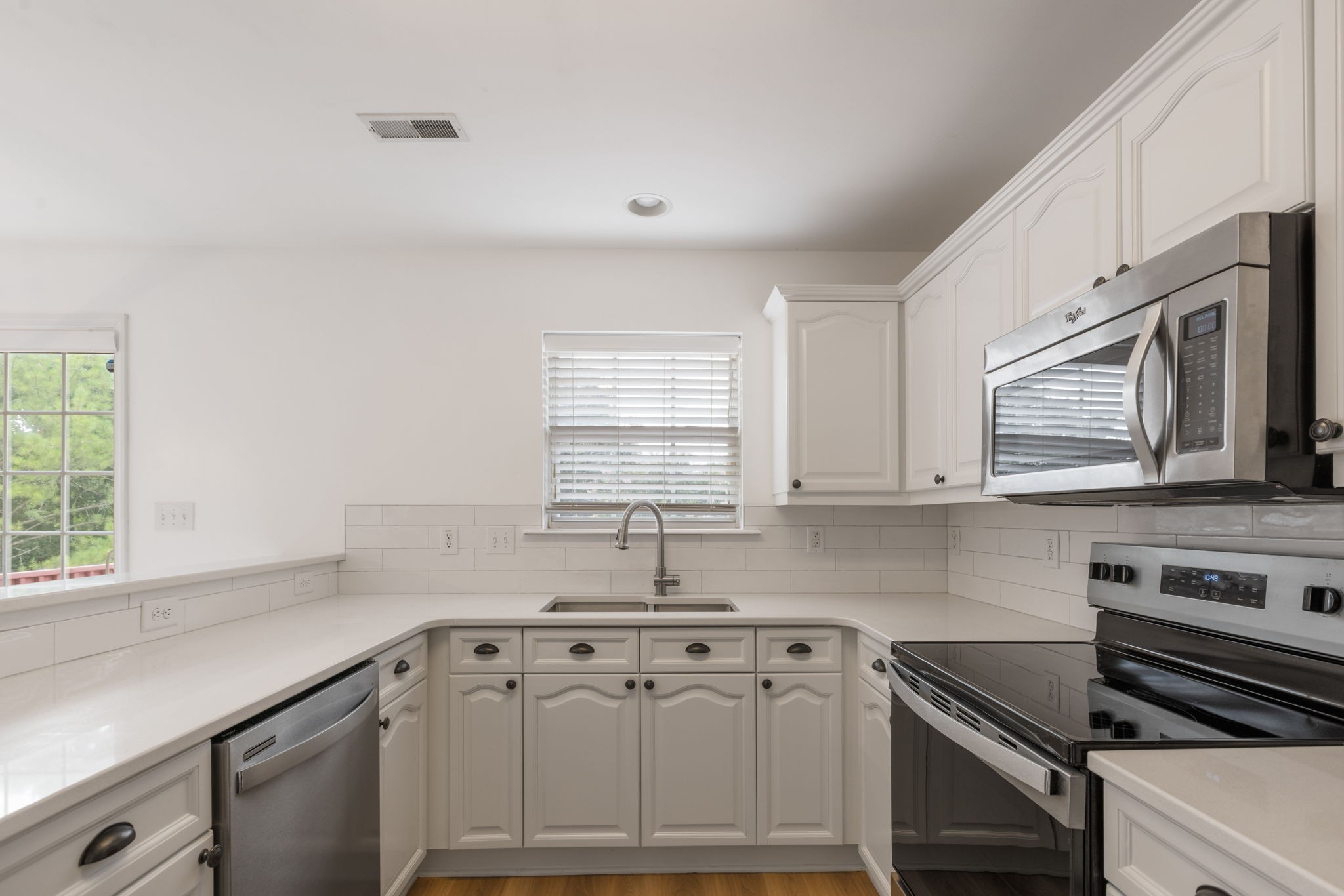 2505 Preston Way Spring Hill, TN 37174 - Photo 13 of 37 a kitchen with stainless steel appliances granite countertop a sink stove and cabinets