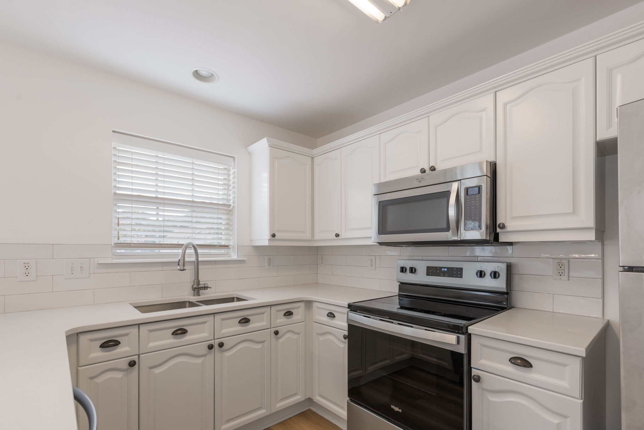 2505 Preston Way Spring Hill, TN 37174 - Photo 14 of 37 a kitchen with cabinets stainless steel appliances a sink and a window