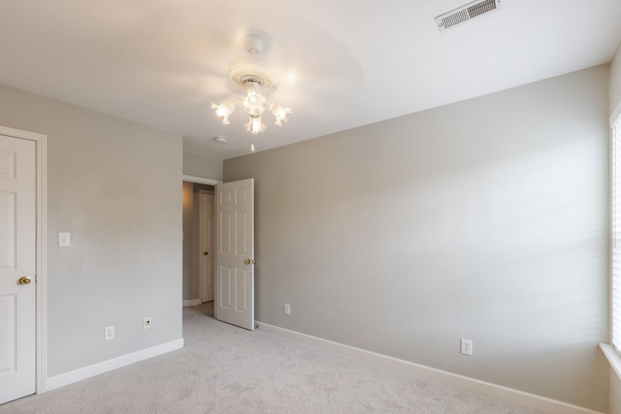 2505 Preston Way Spring Hill, TN 37174 - Photo 21 of 37 an empty room with a chandelier fan and closet area