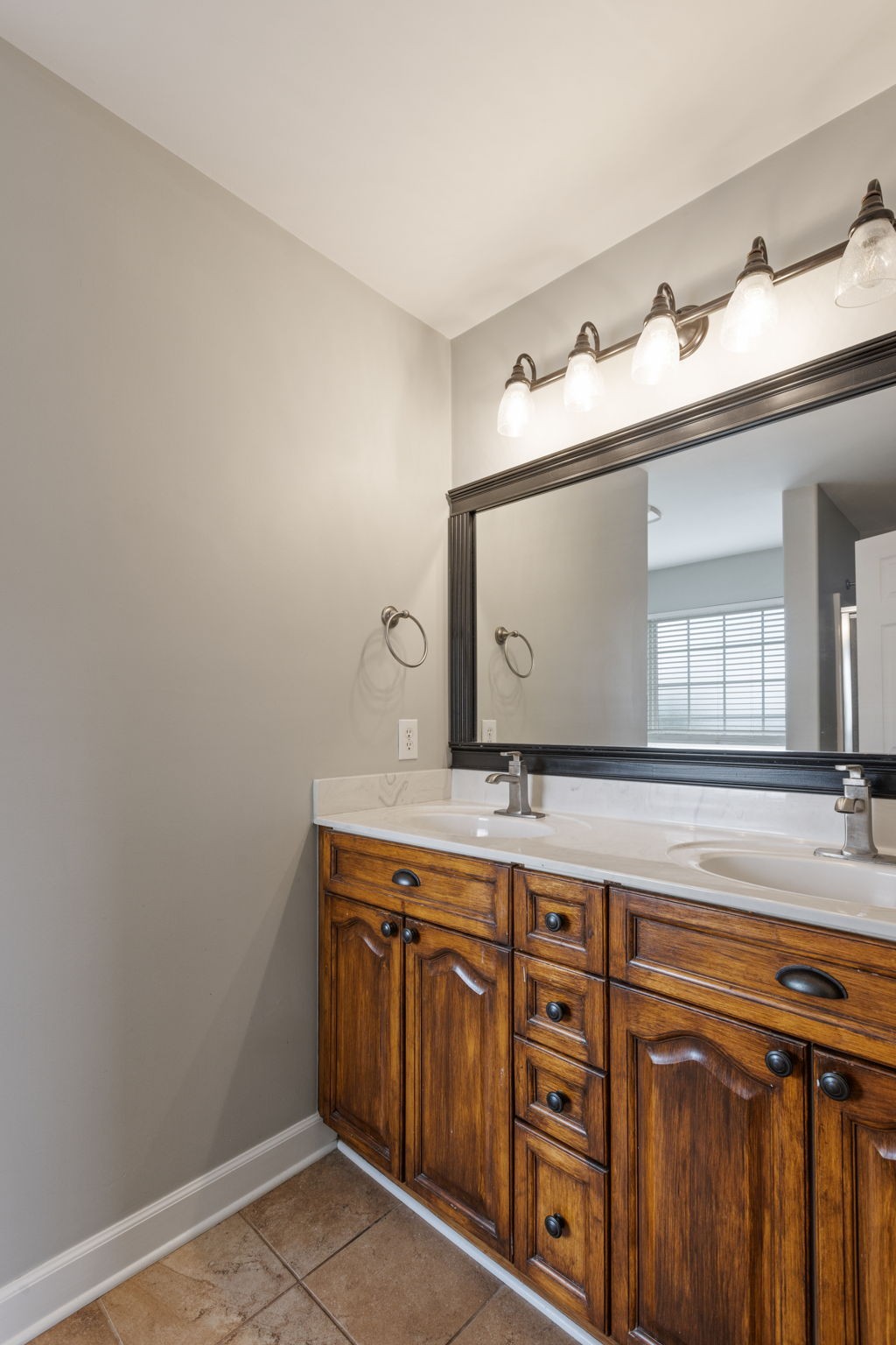 2505 Preston Way Spring Hill, TN 37174 - Photo 28 of 37 a bathroom with a sink a mirror and a vanity