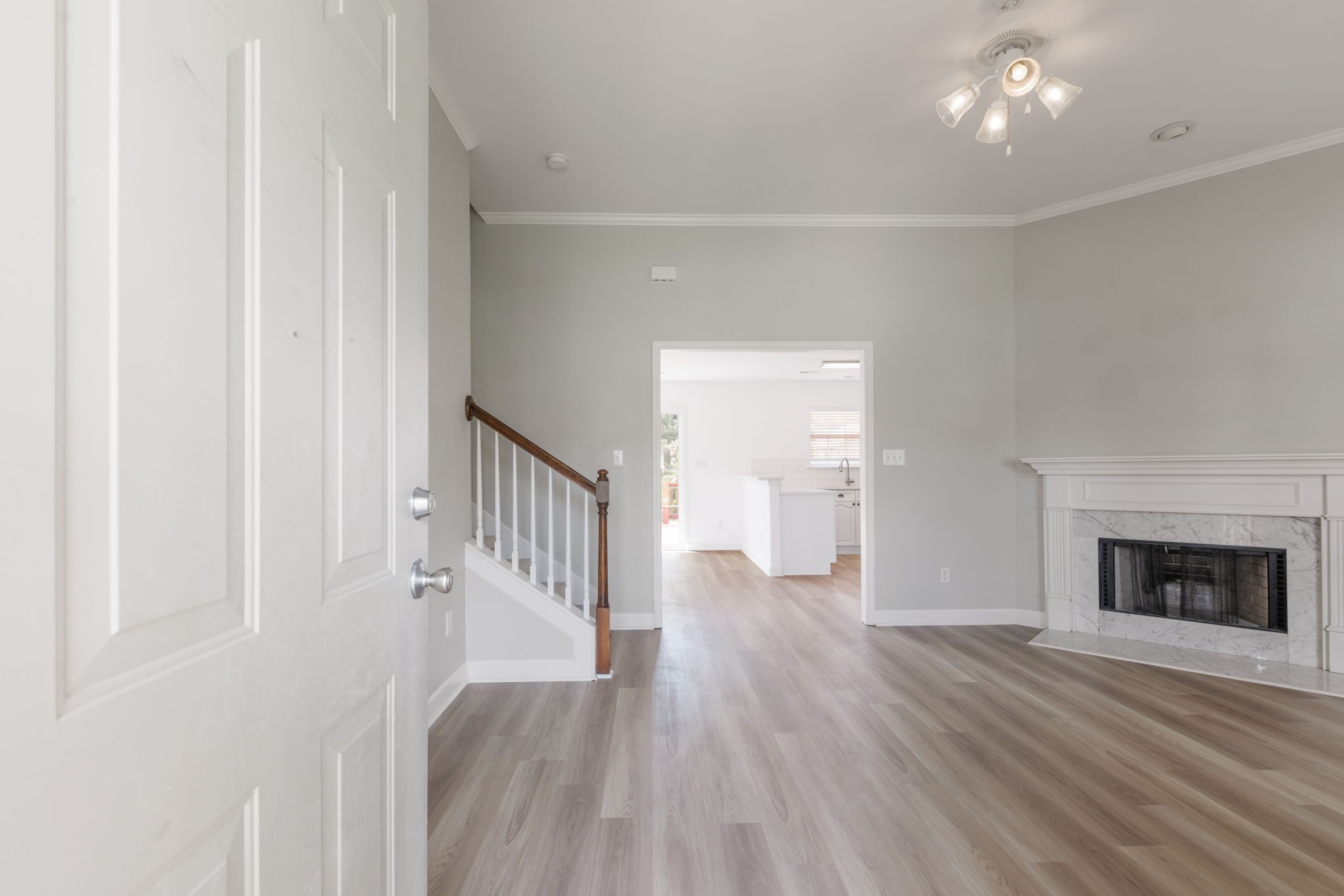 2505 Preston Way Spring Hill, TN 37174 - Photo 6 of 37 a view of a hallway with wooden floor and a fireplace