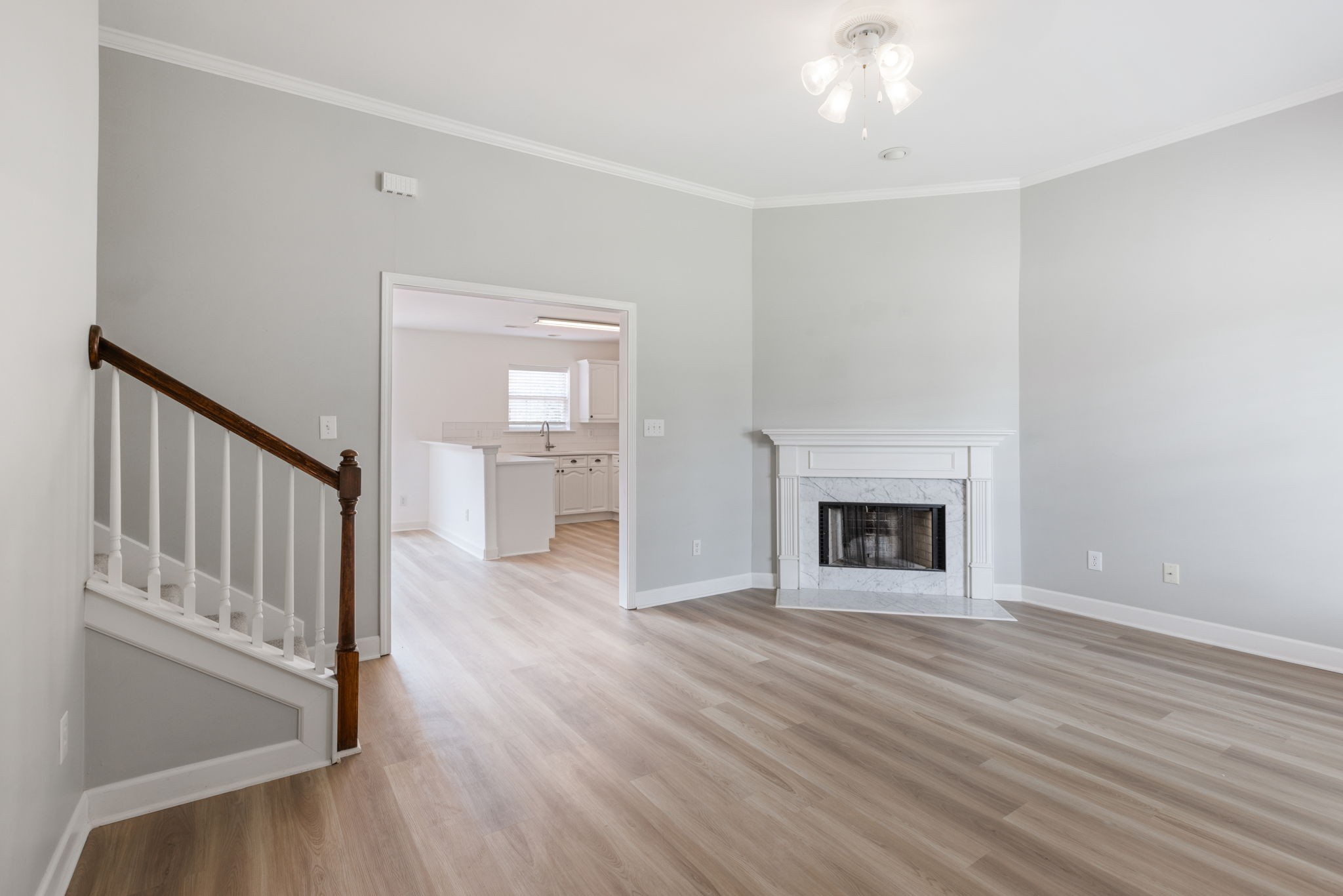 2505 Preston Way Spring Hill, TN 37174 - Photo 7 of 37 a view of a livingroom with wooden floor a fireplace and window