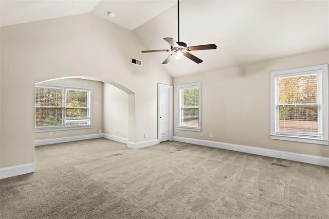 a view of an empty room with a window