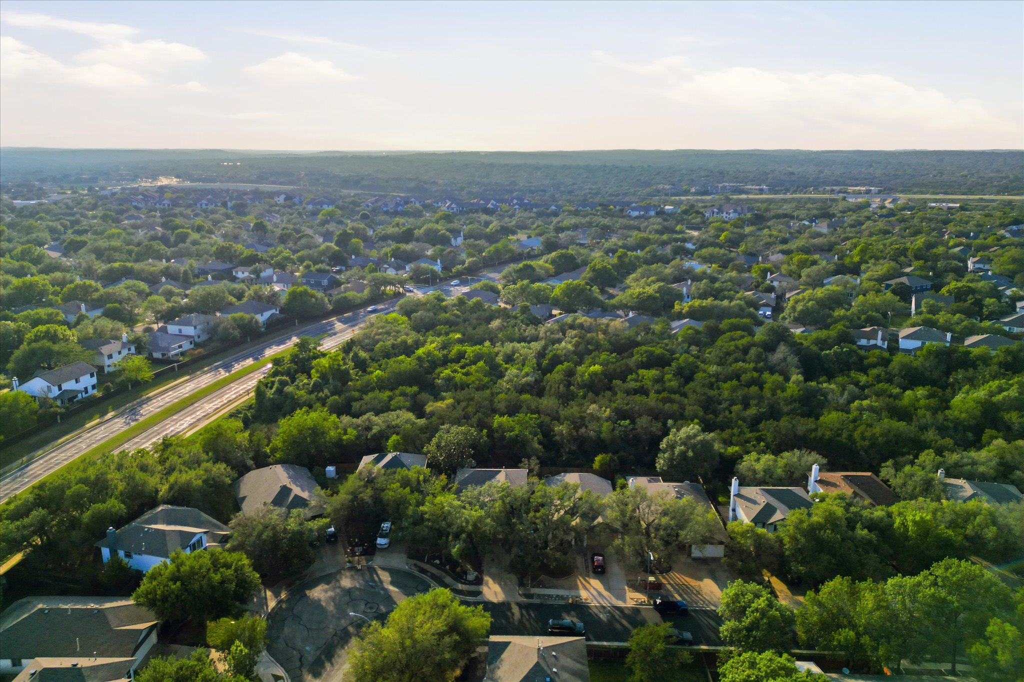 8920 West Hove Loop Austin, TX 78749 - Photo 24 of 39 Aerial perspective showcasing a residential area with extensive tree coverage