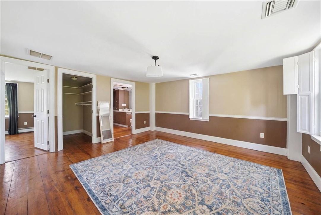 32 Equestrian Way Cranston, RI 02921 - Photo 20 of 50 A rare bonus space on the second floor, this oversized room functions beautifully as a den, media room, reading room or additional gathering area. Its adjoining full bath and walk-in closet enhance functionality, while the room also serves as the access point to the rear third bedroom.