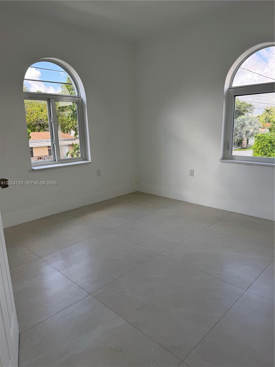 3305 Southwest 28th Street, Unit 3305 Miami, FL 33133 - Photo 14 of 17 an empty room with a window