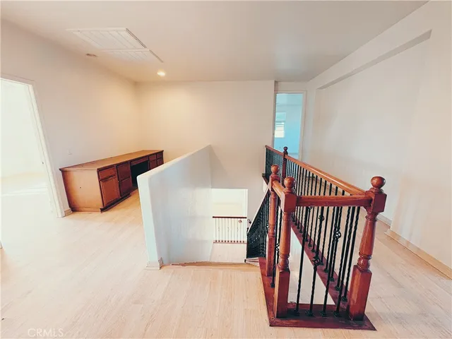 a view of a hallway with staircase