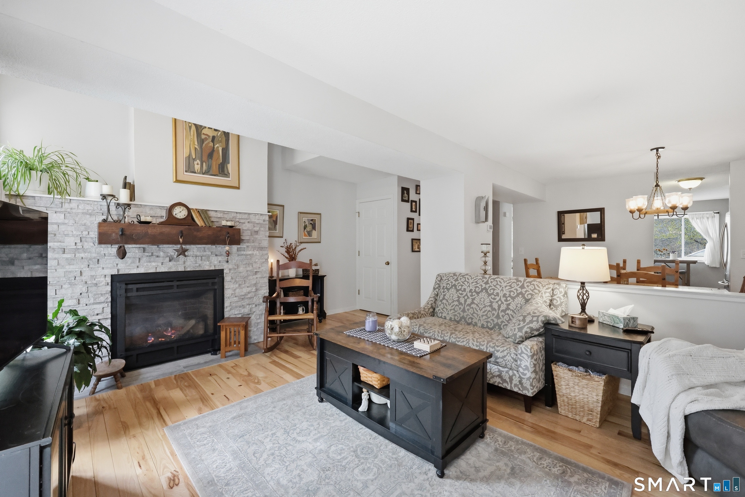 2 Rivermead, Unit 2 Avon, CT 06001 - Photo 1 of 36 a living room with furniture and a fireplace
