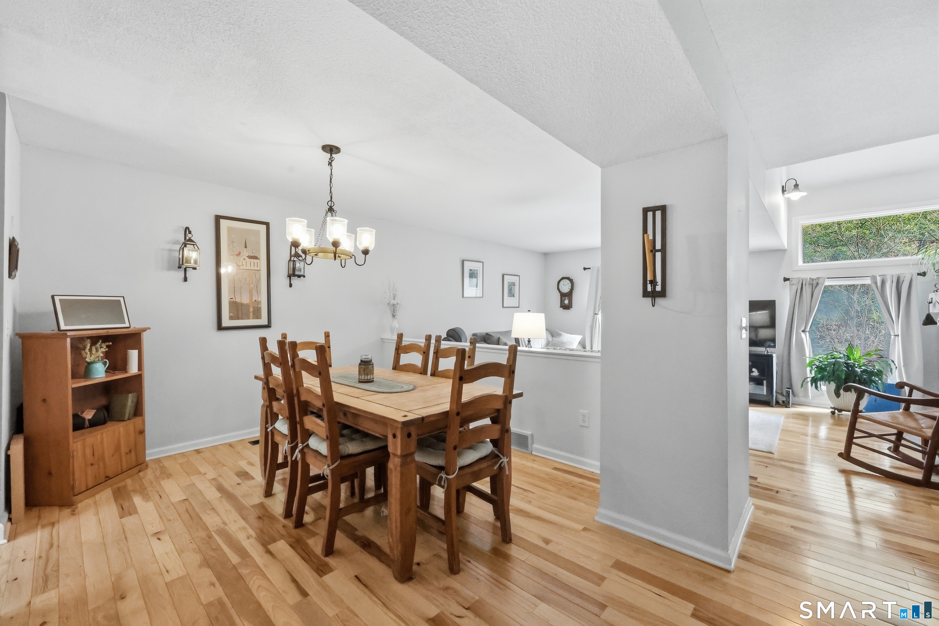 2 Rivermead, Unit 2 Avon, CT 06001 - Photo 11 of 36 a view of a dining room with furniture and wooden floor