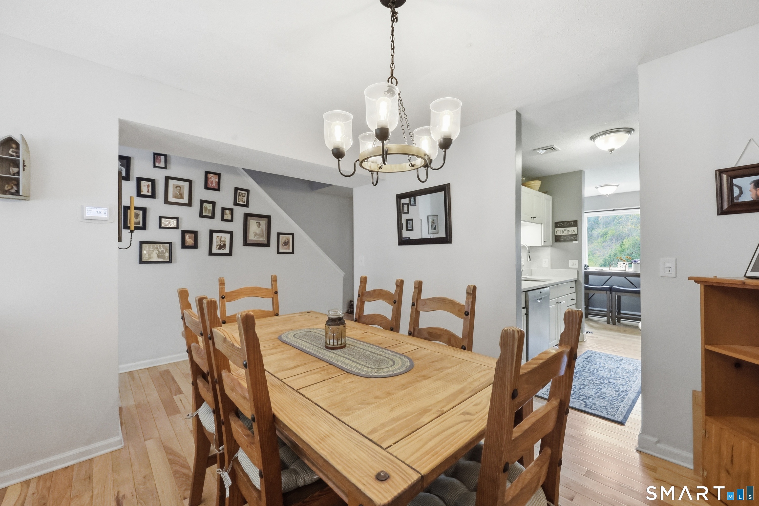 2 Rivermead, Unit 2 Avon, CT 06001 - Photo 9 of 36 a view of a dining room with furniture and chandelier