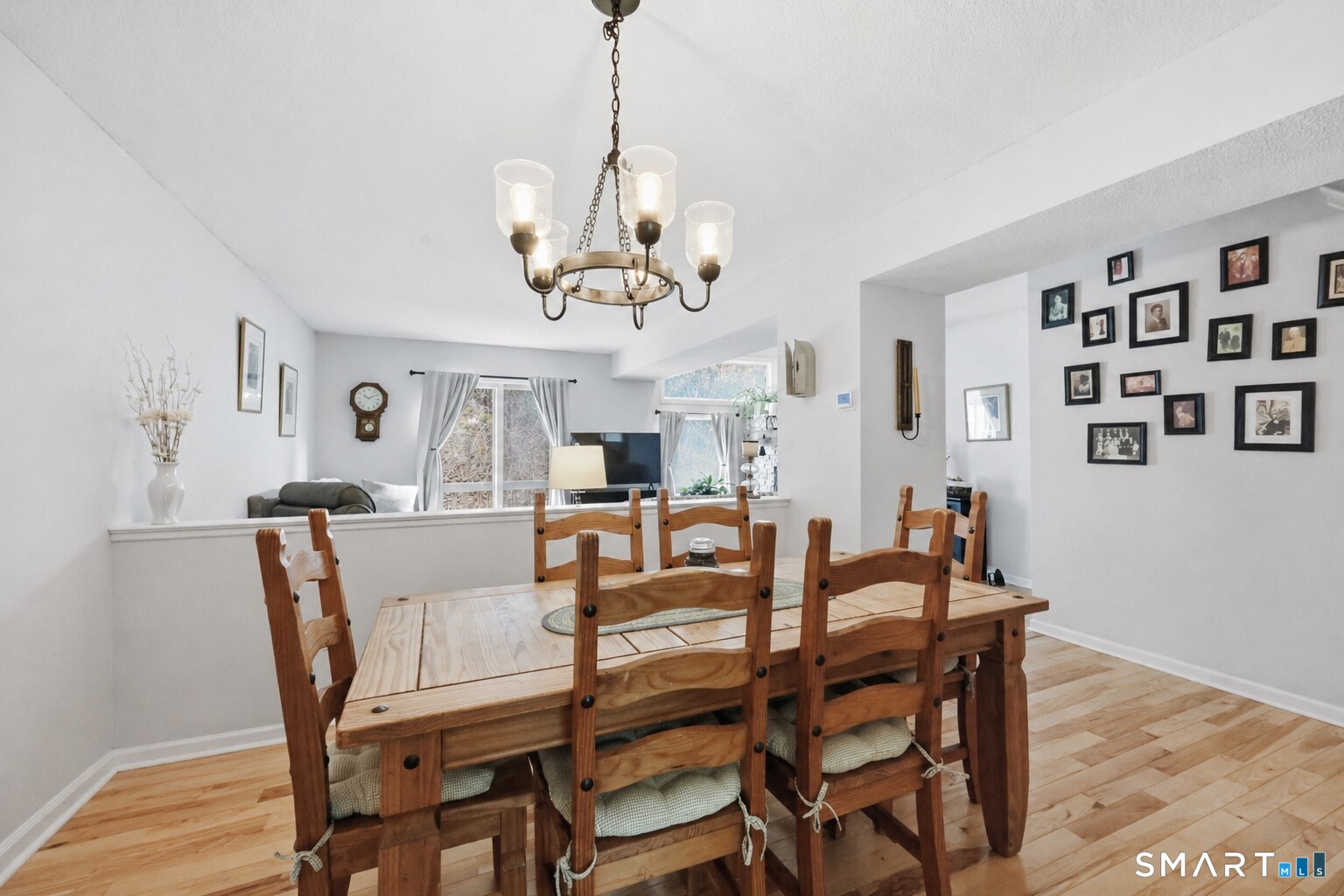 2 Rivermead, Unit 2 Avon, CT 06001 - Photo 10 of 36 a view of a dining room with furniture wooden floor and chandelier