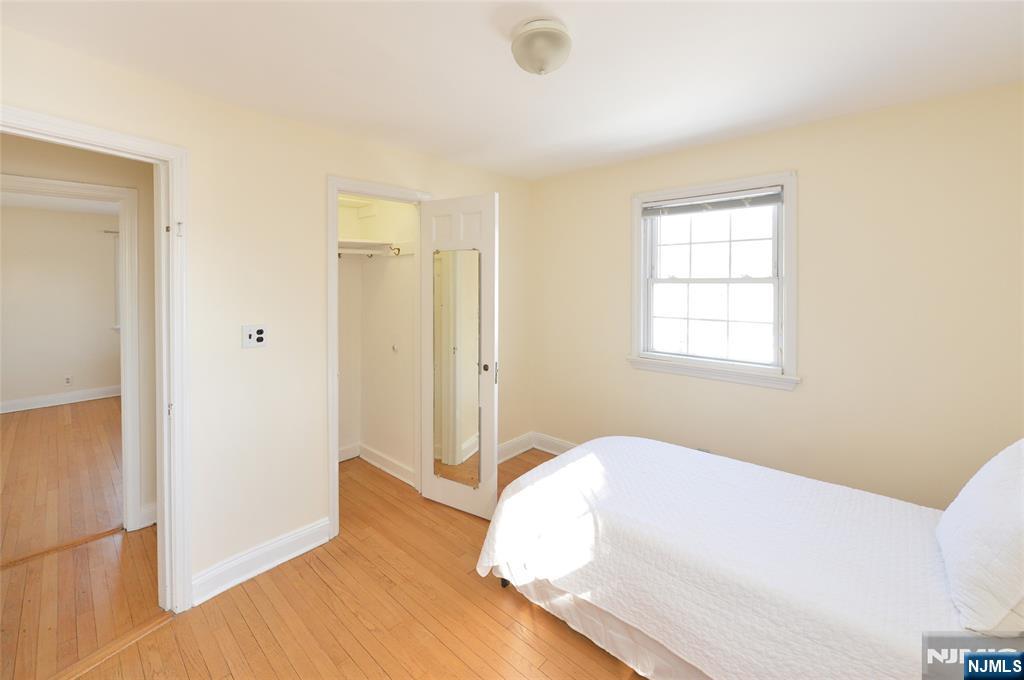 87 Grayson Place Teaneck, NJ 07666 - Photo 14 of 20 a room with a bed and a window