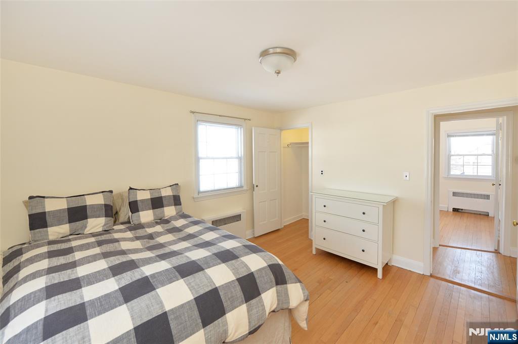 87 Grayson Place Teaneck, NJ 07666 - Photo 16 of 20 a bedroom with a bed and a dresser