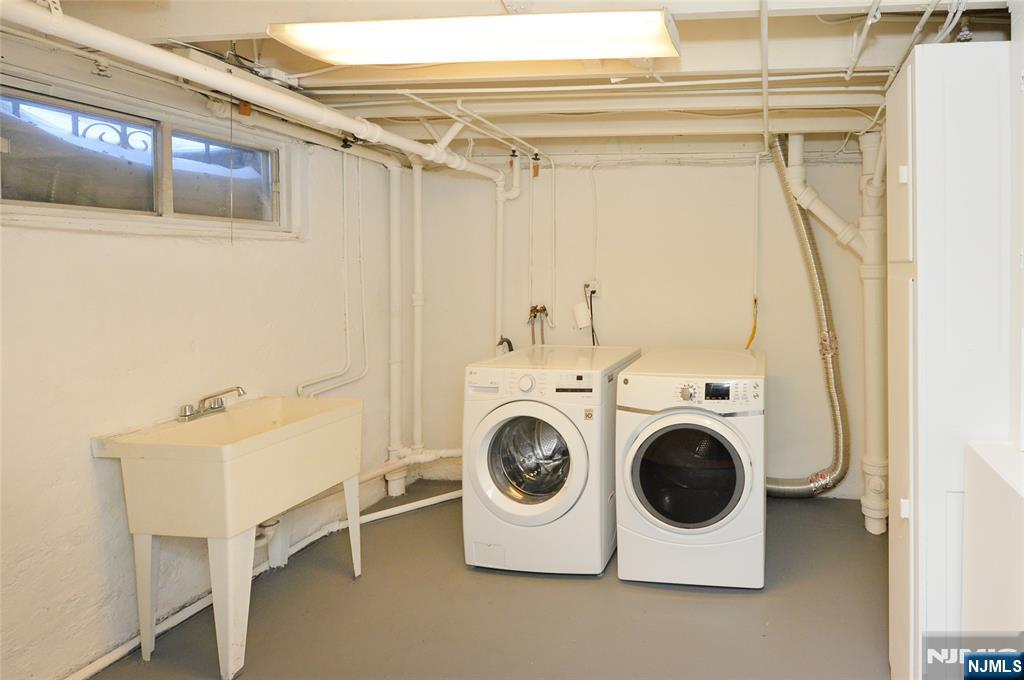 87 Grayson Place Teaneck, NJ 07666 - Photo 17 of 20 a utility room with dryer and washer