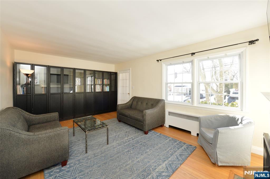 87 Grayson Place Teaneck, NJ 07666 - Photo 3 of 20 a living room with furniture and a window