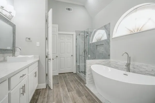 a bathroom with a bathtub and a sink