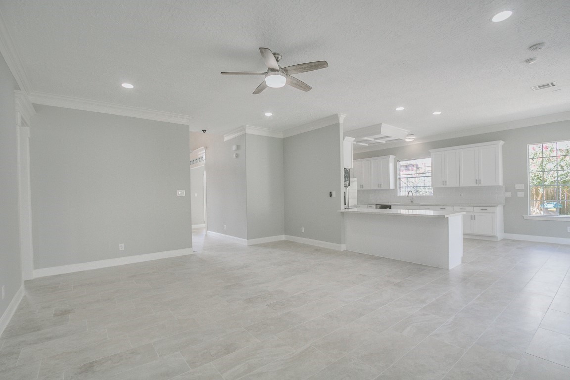 6302 Laver Love Drive Spring, TX 77379 - Photo 14 of 38 an empty room with wooden floor and windows