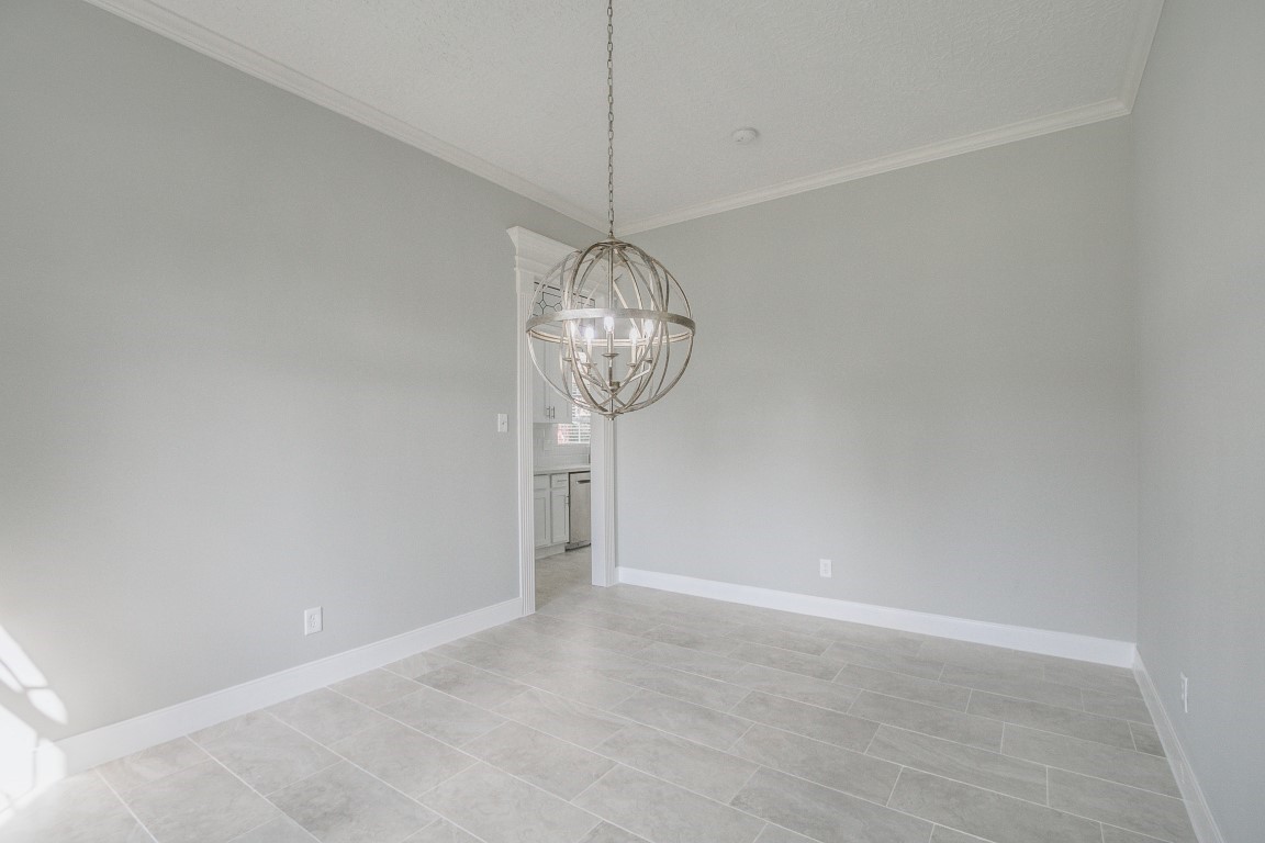 6302 Laver Love Drive Spring, TX 77379 - Photo 21 of 38 a view of a room with a chandelier fan and wooden floor