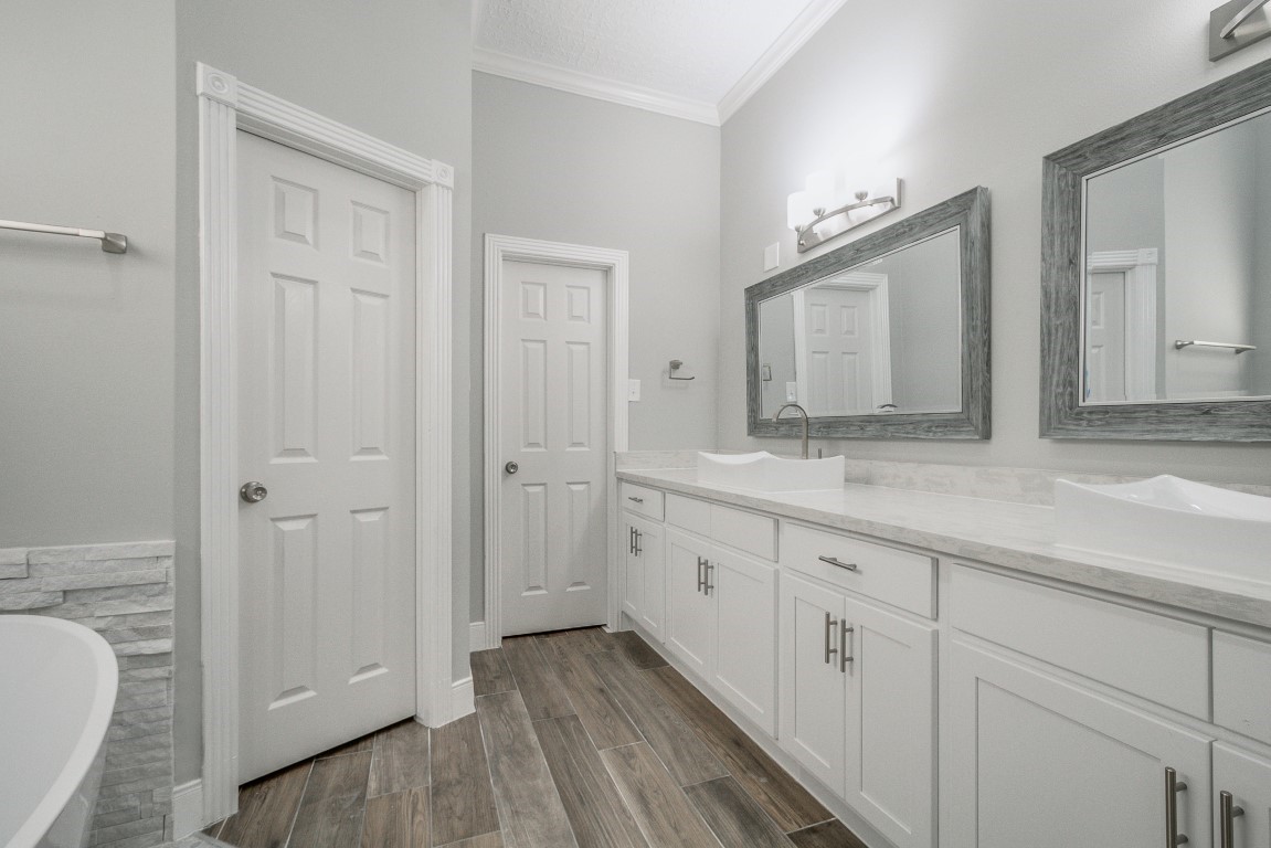 6302 Laver Love Drive Spring, TX 77379 - Photo 10 of 38 a bathroom with a granite countertop sink and a mirror