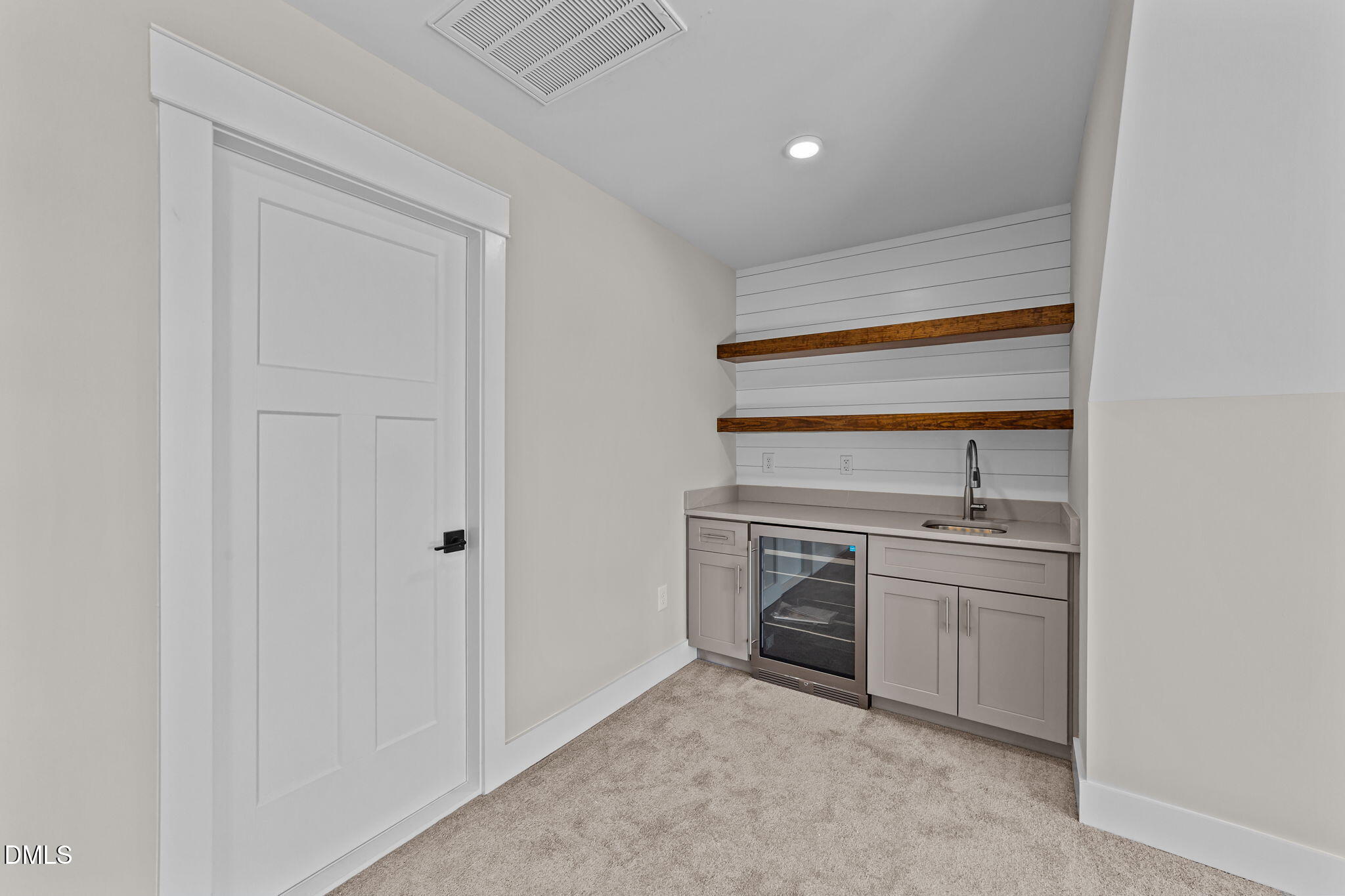 2568 Lassiter Road Four Oaks, NC 27524 - Photo 32 of 50 a kitchen with white cabinets and appliances