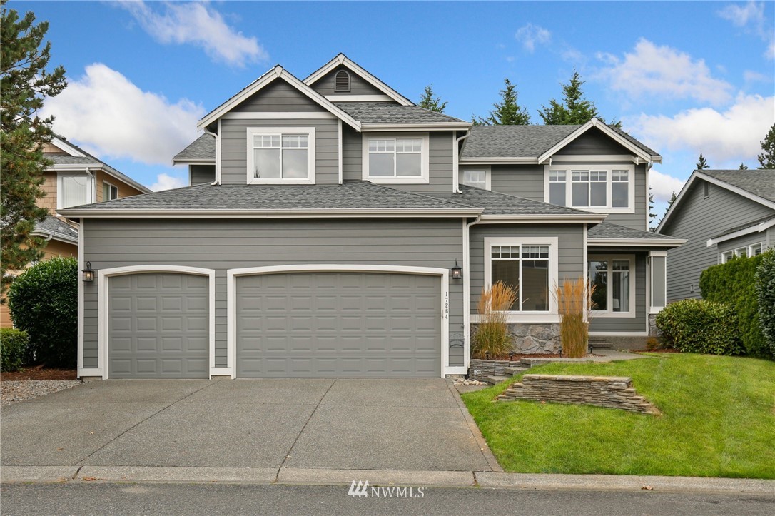 17264 Southeast 185th Street Renton, WA 98058 - Photo 1 of 40 a front view of a house with a yard and garage
