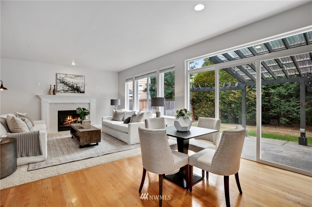 17264 Southeast 185th Street Renton, WA 98058 - Photo 12 of 40 a view of a dining room with furniture wooden floor and windows