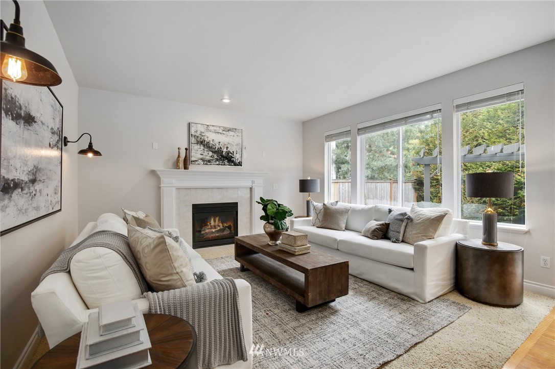 17264 Southeast 185th Street Renton, WA 98058 - Photo 13 of 40 a living room with furniture and a fireplace