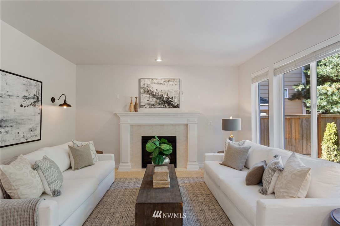 17264 Southeast 185th Street Renton, WA 98058 - Photo 14 of 40 a living room with furniture and a fireplace