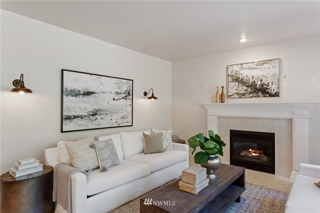 17264 Southeast 185th Street Renton, WA 98058 - Photo 15 of 40 a living room with furniture and a fireplace