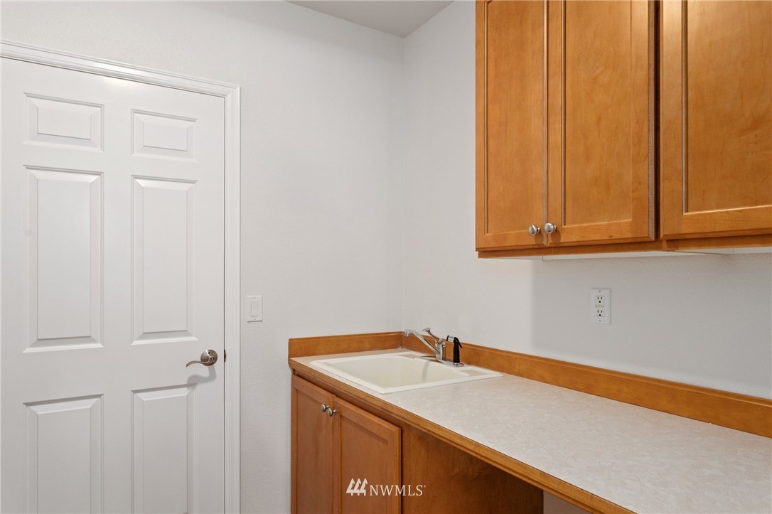 17264 Southeast 185th Street Renton, WA 98058 - Photo 18 of 40 a bathroom with a sink and cabinets